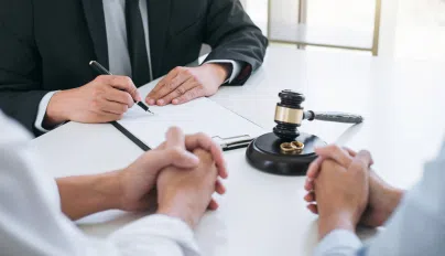 a lawyer talking to their clients about pain and suffering damages