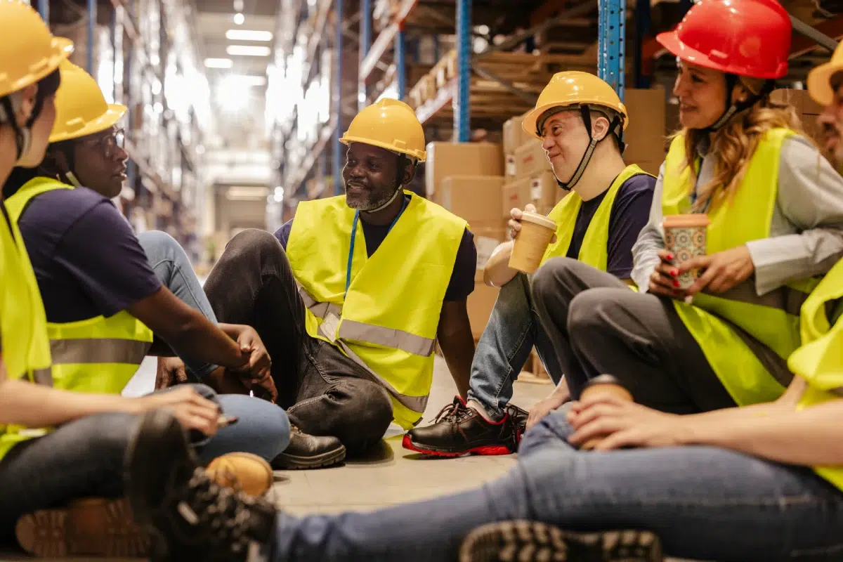 a group of construction workers sitting on a job site