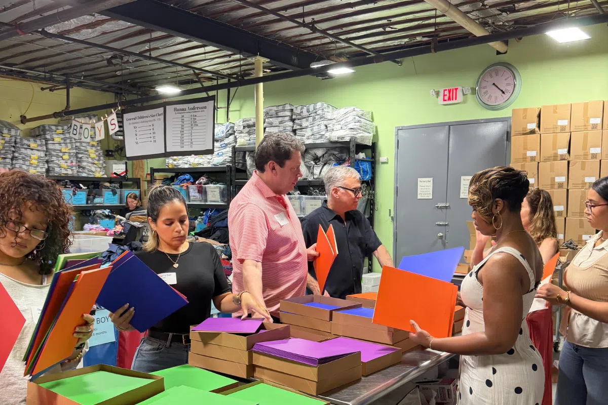 David B. Lever, Daniel G. Ecker, Geraldine, and the Lever & Ecker team at the Sharing Shelf event in Port Chester