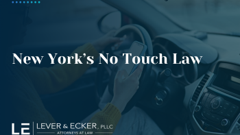 a person holding their phone while driving in New York