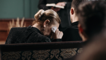 Woman crying at a funeral